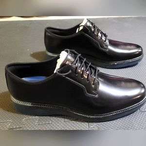 Cole Haan dress shoes. Black with blue soles. Size 12M